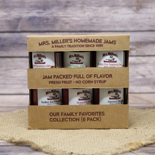 A gift set of assorted mini Mrs. Miller's Jams, on rustic burlap with a wooden background.