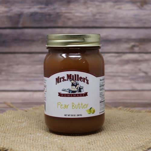 A 20oz glass jar of Mrs. Miller's Pear Butter, on rustic burlap with a wooden background.