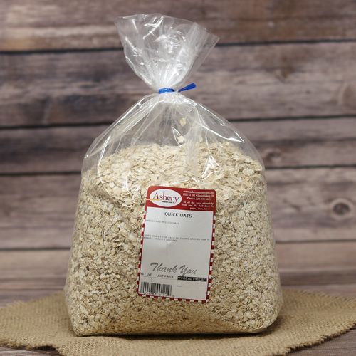 A bag of Quick Oats, sealed with a twist tie, on rustic burlap with a wooden background.