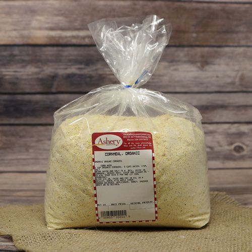 A bag of Organic Cornmeal, sealed with a twist tie, on rustic burlap with a wooden background.