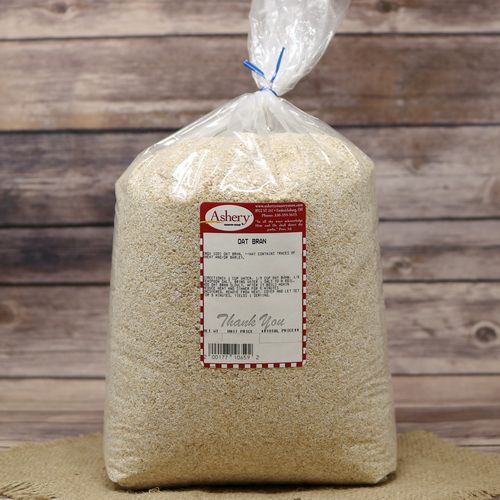 A bag of Oat Bran, sealed with a twist tie, on rustic burlap with a wooden background.