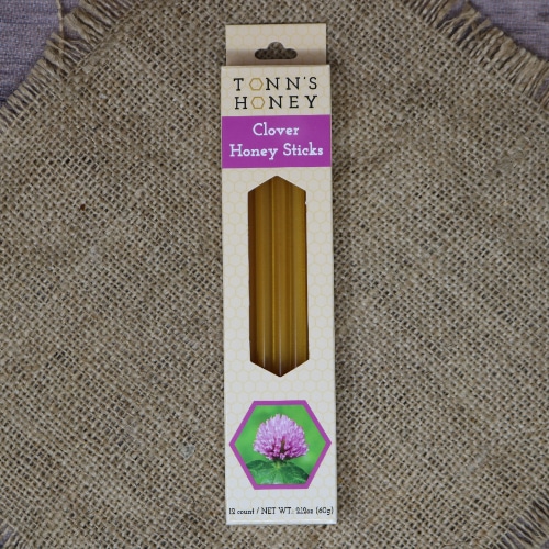 A box of Tonn's Clover Honey Sticks on rustic burlap.