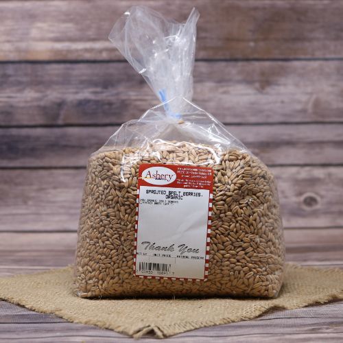 Bag of Organic Sprouted Spelt Berries on a burlap material against a rustic background.