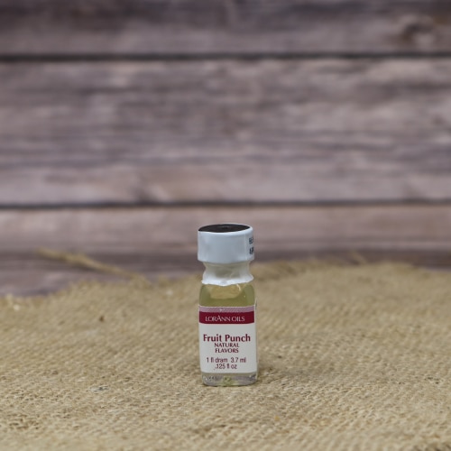 Small bottle of LorAnn Fruit Punch Flavor extract on a burlap cloth with a rustic wood backdrop.