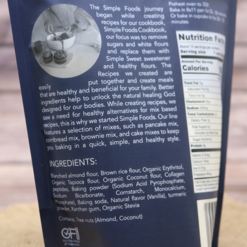 Back of a package of Simple Foods Yellow Cake Mix focusing on the ingredients list and brand story.