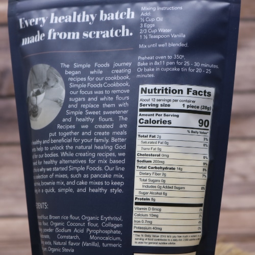 Back of a package of Simple Foods Yellow Cake Mix showing nutrition facts, ingredients, and preparation instructions.