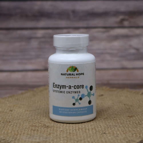 A plastic bottle with blue writing of Enzym-a-Core Enzymes by Natural Hope Herbals on rustic burlap with a wooden background.