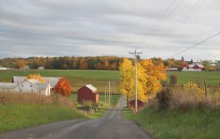 Red barn in fall landscape in amish country.